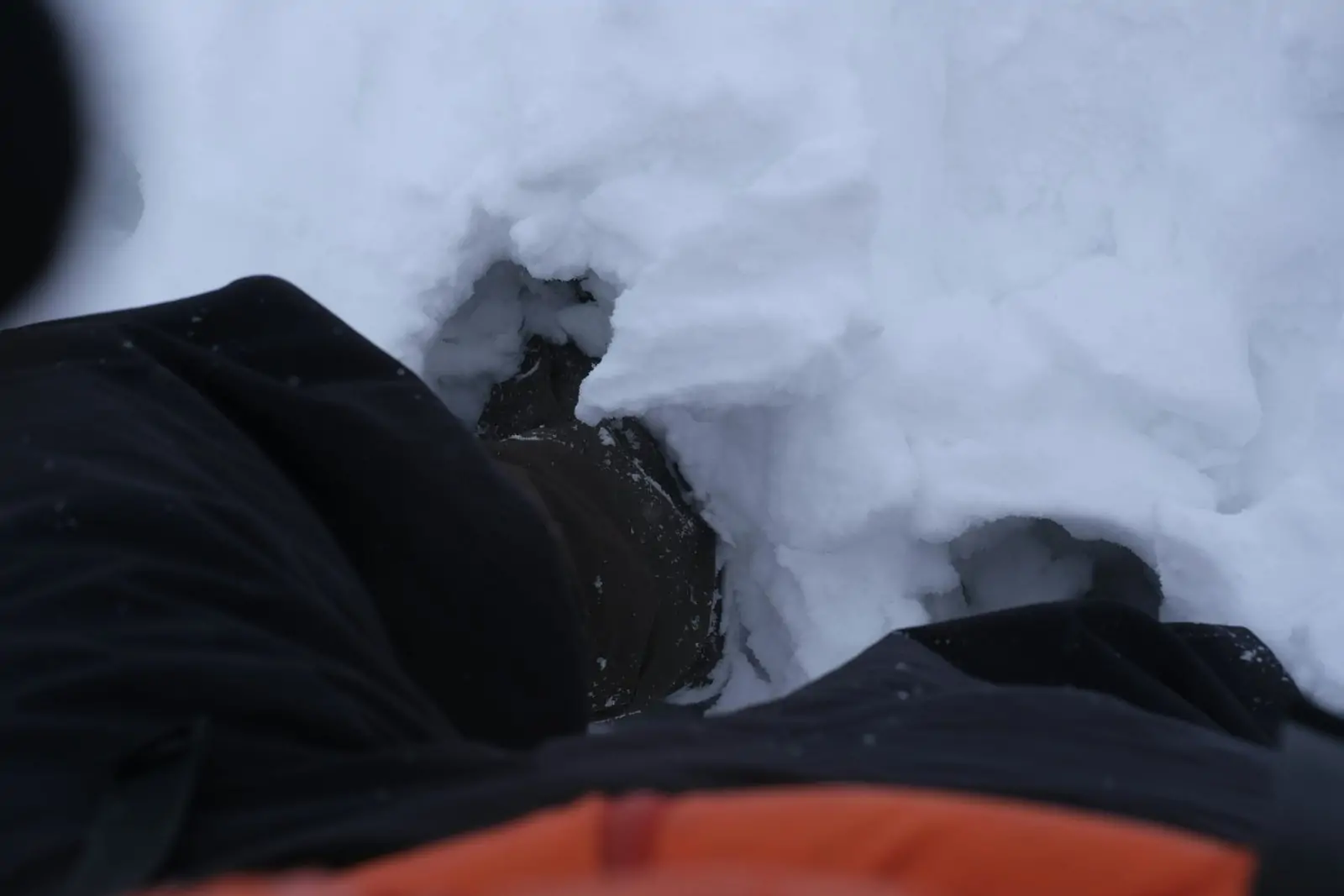 a-person-is-laying-down-in-the-snow-scaled-1
